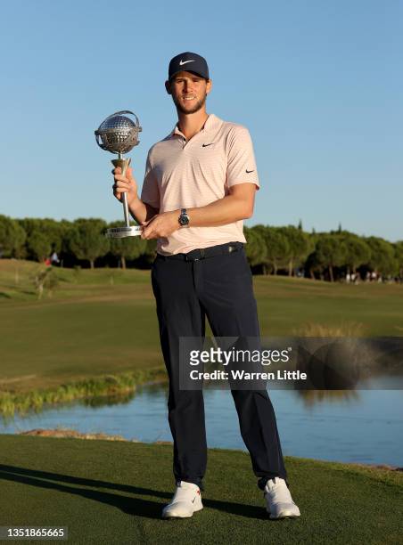 Thomas Pieters of Belgium celebrates with the winners trophy after the final round of the Portugal Masters at Dom Pedro Victoria Golf Course on...