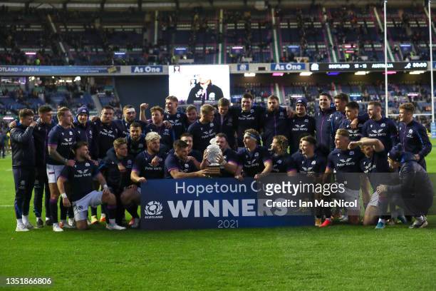 Ewan Ashman of Scotland lifts the trophy as his team mates celebrate following victory in the Autumn Nations Series match between Scotland and...