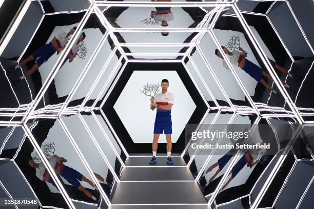 Novak Djokovic of Serbia poses with the trophy after winning the mens singles final against Daniil Medvedev of Russia on day seven of the Rolex Paris...