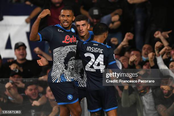 Giovanni Di Lorenzo of SSC Napoli celebrates with teammates Juan Jesus and Lorenzo Insigne after scoring their side's first goal during the Serie A...