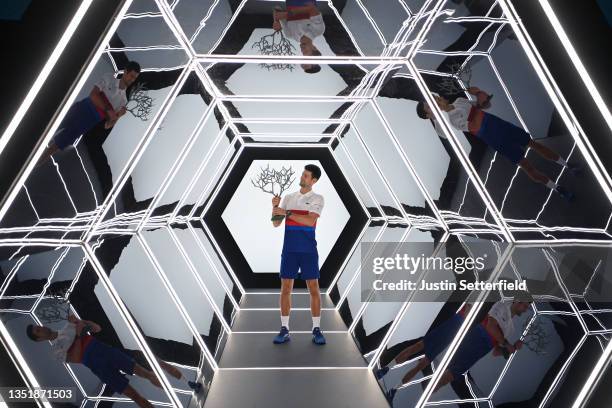 Novak Djokovic of Serbia poses with the trophy after winning the mens singles final against Daniil Medvedev of Russia on day seven of the Rolex Paris...