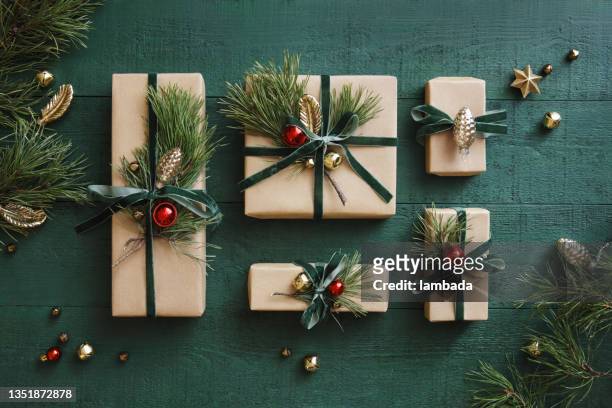 high angle view of christmas presents - christmas paper stock pictures, royalty-free photos & images