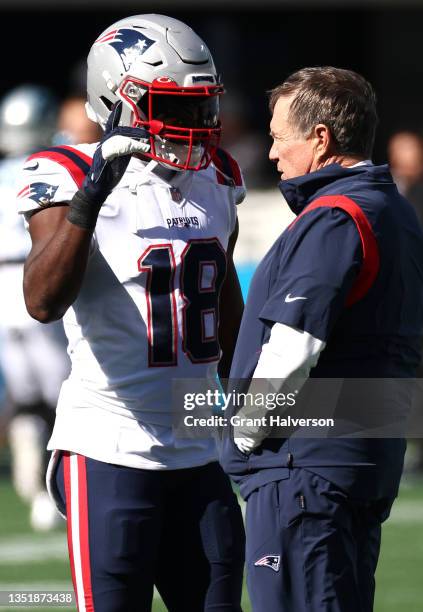 Head coach Bill Belichick of the New England Patriots talks with Matthew Slater before the game against the Carolina Panthers at Bank of America...