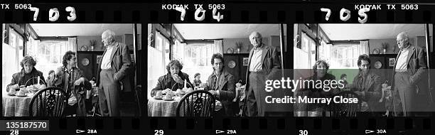 From left to right, British actors Paul McGann, Richard E. Grant and Llewellyn Rees film a scene in Stony Stratford, Buckinghamshire, for the movie...