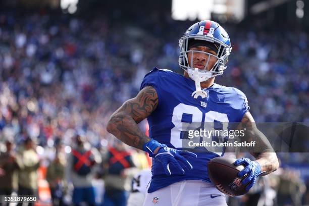 Evan Engram of the New York Giants reacts after scoring a touchdown during the first quarter in the game against the Las Vegas Raiders at MetLife...
