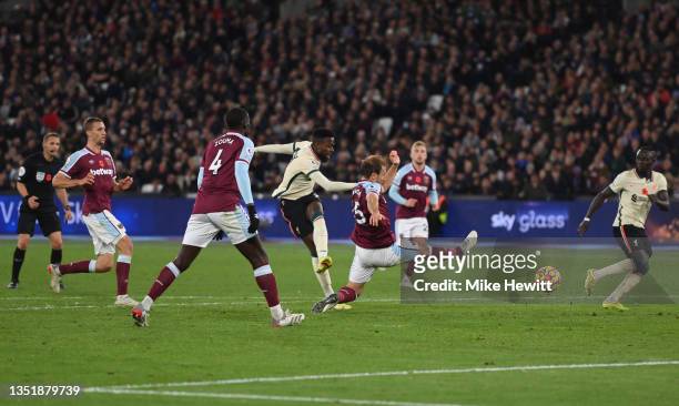 Divock Origi of Liverpool scores their side's second goal during the Premier League match between West Ham United and Liverpool at London Stadium on...