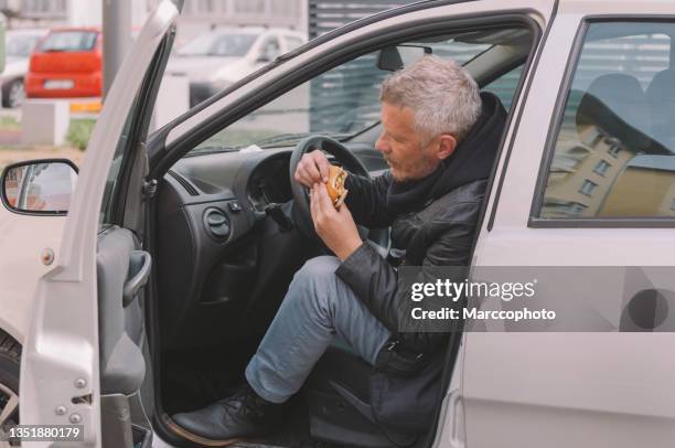 take out food - eating in car stock pictures, royalty-free photos & images