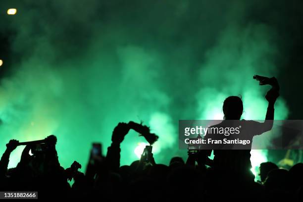 Silhouette of Real Betis fans welcoming their team to the stadium prior to the La Liga Santander match between Real Betis and Sevilla FC at Estadio...