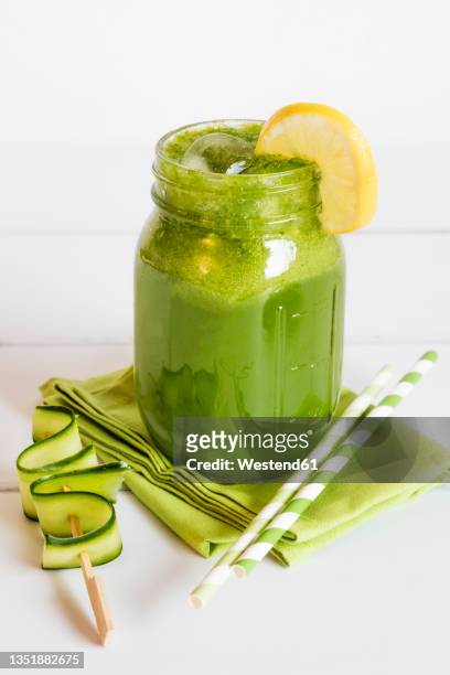 mango, corn salad and cucumber smoothie with slice of lemon - mango smoothie stock pictures, royalty-free photos & images