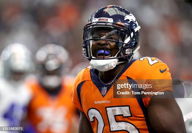 Melvin Gordon of the Denver Broncos celebrates after scoring a touchdown during the first quarter against the Dallas Cowboys at AT&T Stadium on...