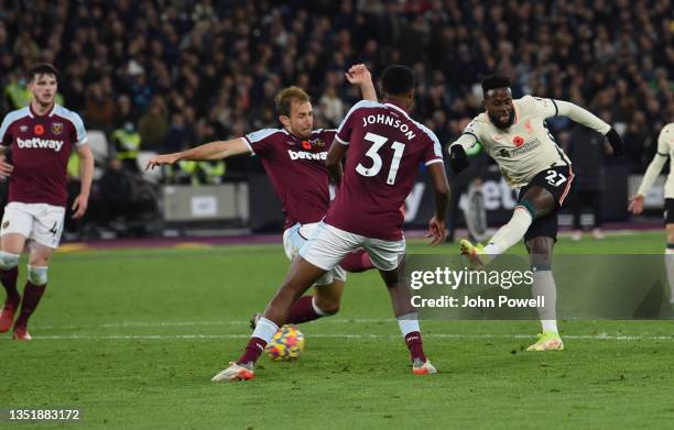 Divock Origi of Liverpool scores the second goal making the score 3-2 during the Premier League match between West Ham United and Liverpool at London...