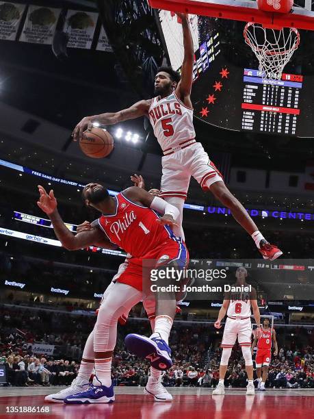 Derrick Jones Jr. #5 of the Chicago Bulls blocks a shot by Andre Drummond of the Philadelphia 76ers at the United Center on November 06, 2021 in...