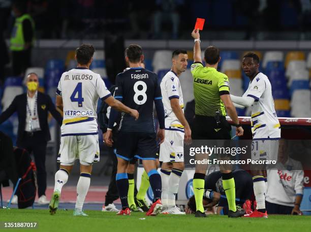 Nikola Kalinic of Hellas Verona is shown a red card by referee, Giovanni Ayroldi during the Serie A match between SSC Napoli v Hellas Verona FC at...