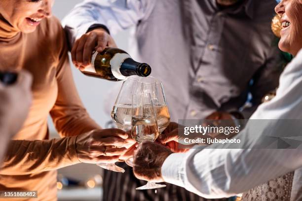 close up of drinking champagne on new year's party. - 70 year male stock pictures, royalty-free photos & images