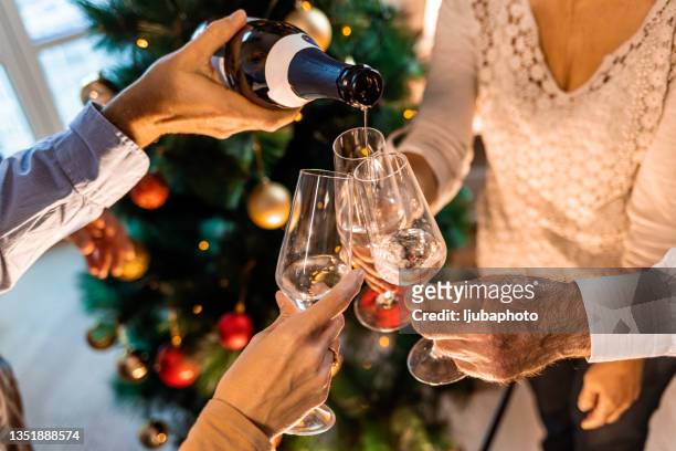 family new year's eve party. - christmas drinks stockfoto's en -beelden
