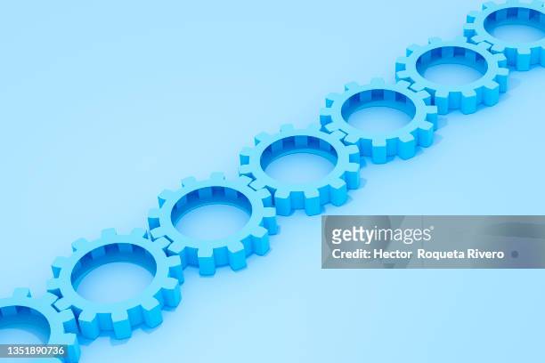 three dimensional blue gears abstract with copy space - engineer gearwheel factory stockfoto's en -beelden