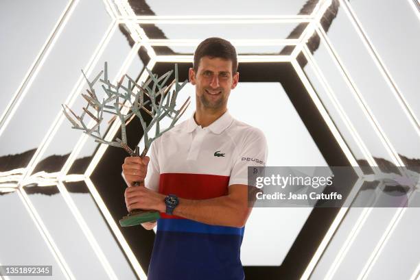 Winner Novak Djokovic of Serbia poses with the trophy after winning the Rolex Paris Masters 2021 Final, an ATP Masters 1000 tennis tournament at...