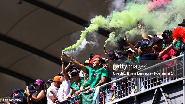 Sergio Perez of Mexico and Red Bull Racing fans show their support during the F1 Grand Prix of Mexico at Autodromo Hermanos Rodriguez on November 07,...