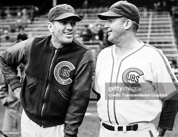 Hall of Fame baseball players Dizzy Dean, left and Gabby Hartnett share a joke before a game at Wrigley Field in Chicago, Illinois in 1938.