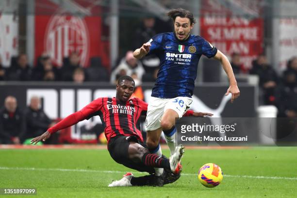Matteo Darmian of FC Internazionale is fouled by Fode Ballo-Toure of AC Milan leading to a penalty during the Serie A match between AC Milan and FC...