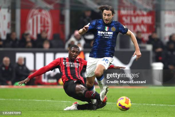 Matteo Darmian of FC Internazionale is fouled by Fode Ballo-Toure of AC Milan leading to a penalty during the Serie A match between AC Milan and FC...