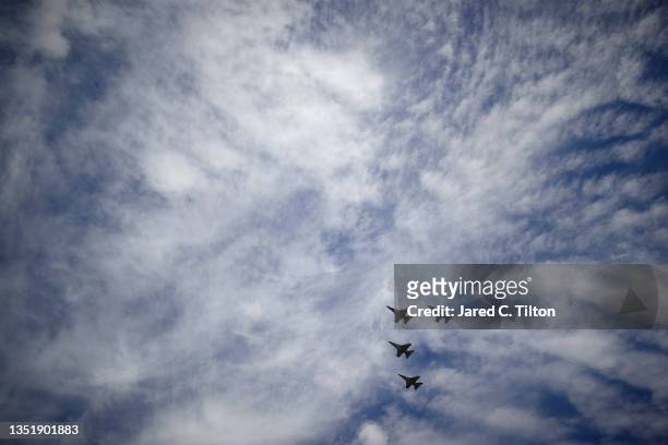 The F-16 Fighting Falcons perform a flyover during pre-race ceremonies prior to the NASCAR Cup Series Championship at Phoenix Raceway on November 07,...