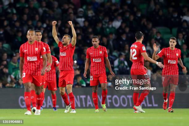 Players of Sevilla FC celebrate their team's first goal during the La Liga Santander match between Real Betis and Sevilla FC at Estadio Benito...