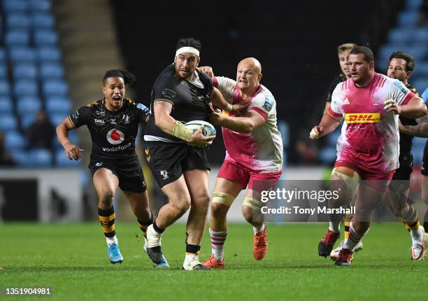 Jeff Toomaga-Allen of Wasps is tackled by Tom Lawday of Harlequins during the Gallagher Premiership Rugby match between Wasps and Harlequins at The...