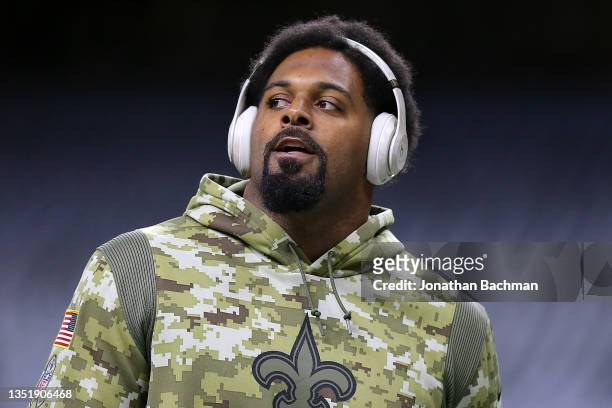 Cameron Jordan of the New Orleans Saints warms up before a game against the Atlanta Falcons at the Caesars Superdome on November 07, 2021 in New...