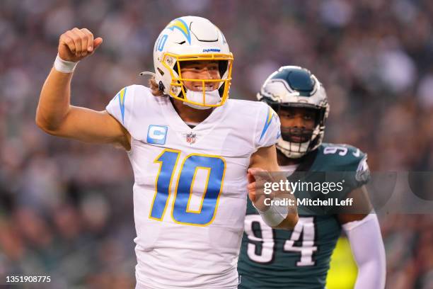 Quarterback Justin Herbert of the Los Angeles Chargers reacts after throwing a first quarter touchdown pass against the Philadelphia Eagles at...