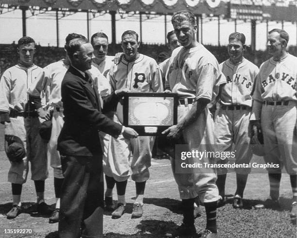 Carl Hubbell, Hall of Fame pitcher for the New York Giants accepts the National League Most Valuable Player award for 1933 during a ceremony in the...