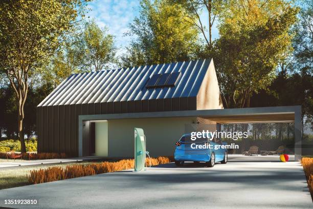 modern house with electric charging station - car on driveway bildbanksfoton och bilder
