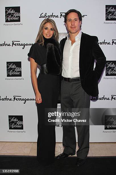 Raquel Allec and Champ Car racer Mario Dominguez attend the Salvatore Ferragamo "Resort 2012" collection launch at Saks Fifth Avenue Plaza Carso on...