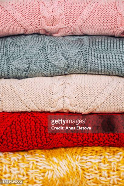 stack of knitted sweaters - vestido color carne fotografías e imágenes de stock