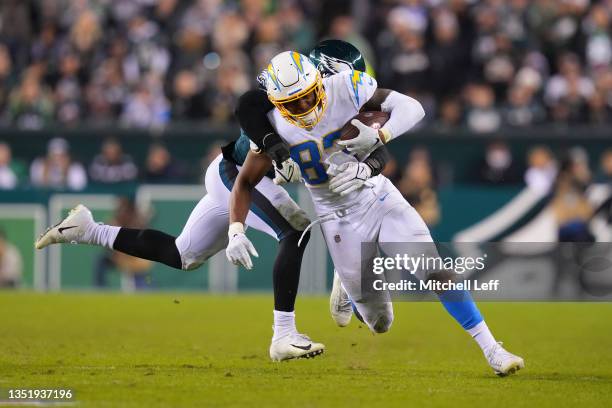 Stephen Anderson of the Los Angeles Chargers runs with the ball as Davion Taylor of the Philadelphia Eagles goes for the tackle in the fourth quarter...