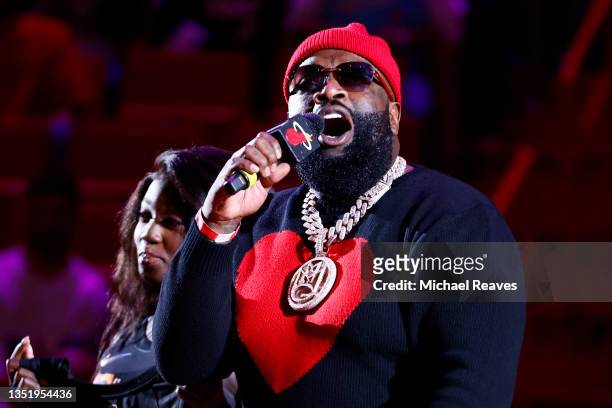 Rapper Rick Ross announces his new album during a timeout in the game between the Miami Heat and the Boston Celtics at FTX Arena on November 04, 2021...