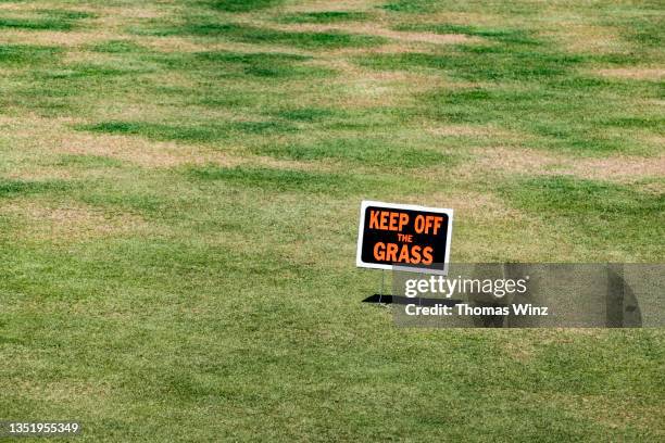 warning sign at a sports field - keep off the grass sign stock pictures, royalty-free photos & images