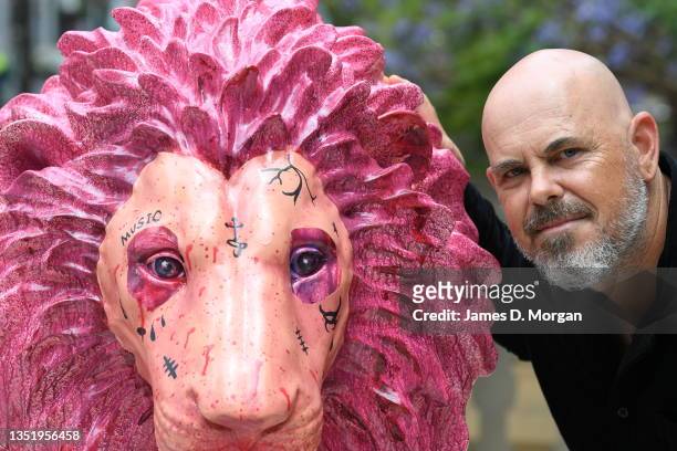 Artist David Griggs is seen with his art installation titled "Civilian Warrior" after being unveiled on the steps of Town Hall on November 08, 2021...