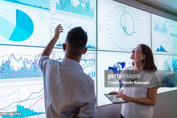 uk, york, business people discussing charts on interactive screens - multiple screens stock pictures, royalty-free photos & images