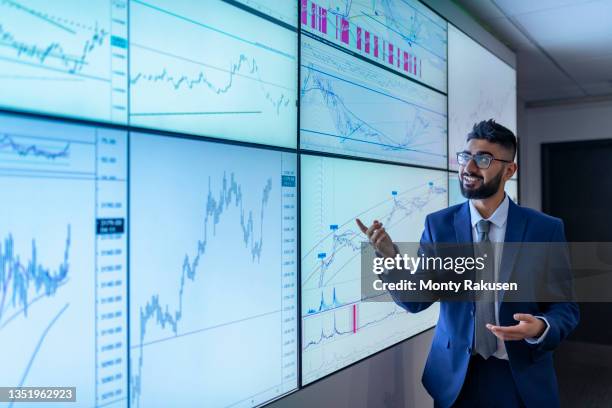 uk, york, businessman having presentation at interactive screens - multiple screens stock pictures, royalty-free photos & images