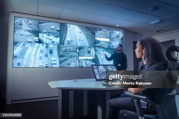 uk, york, male and female operators in traffic control room - highway patrol stock-fotos und bilder