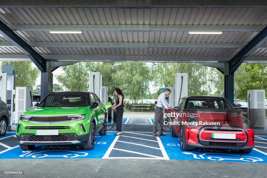 UK, York, People charging their electric cars at charging station