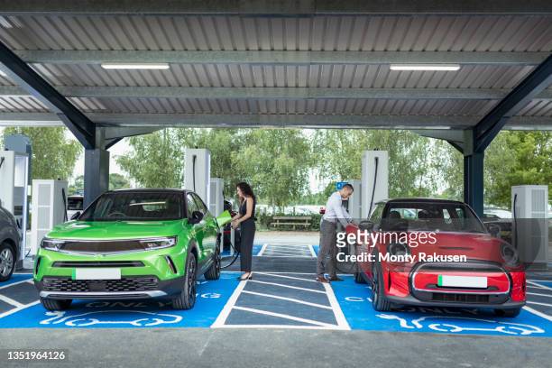 uk, york, people charging their electric cars at charging station - tesla motors stock pictures, royalty-free photos & images