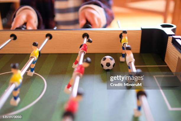 close up hands playing table football game - fotbollsspel bildbanksfoton och bilder