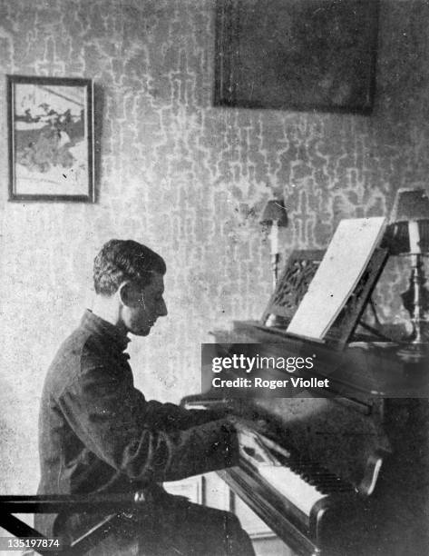Maurice Ravel , French composer, playing the piano in France, January 1913.