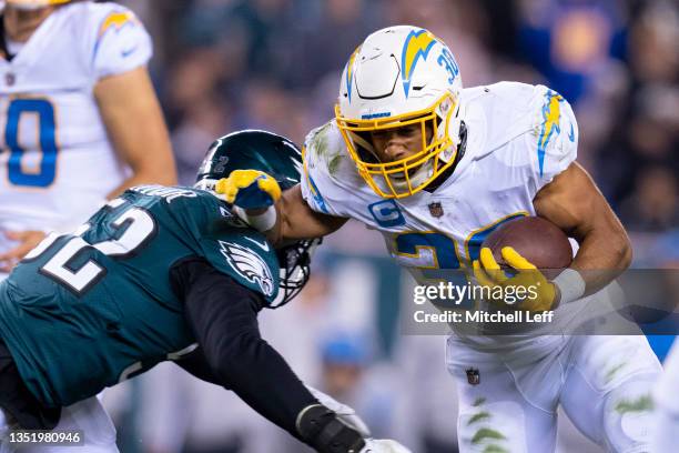 Austin Ekeler of the Los Angeles Chargers runs the ball against Davion Taylor of the Philadelphia Eagles at Lincoln Financial Field on November 7,...