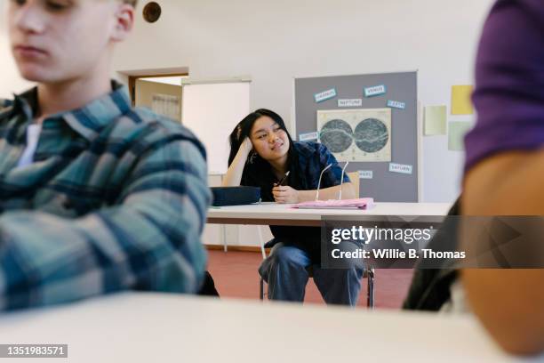 high school student resting on desk during class - student day dreaming stock pictures, royalty-free photos & images