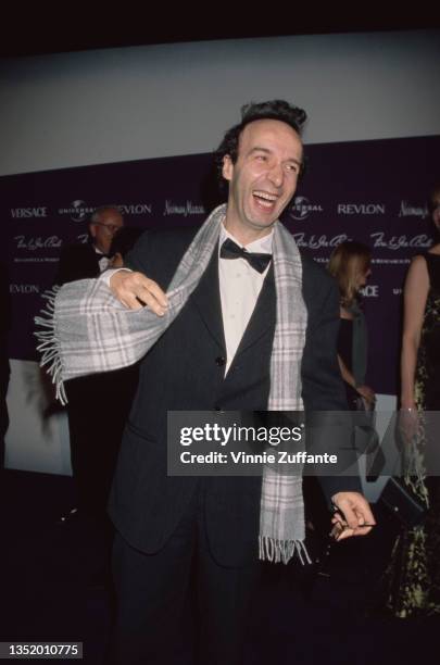 Italian actor and comedian Roberto Benigni, wearing a black tuxedo and bow tie with a grey-and-white plaid scarf, attends the 9th Annual Fire & Ice...