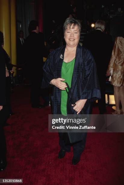 American actress Kathy Bates, wearing a dark blue trouser suit with a green top, attends the 11th Annual American Comedy Awards, held at the Shrine...