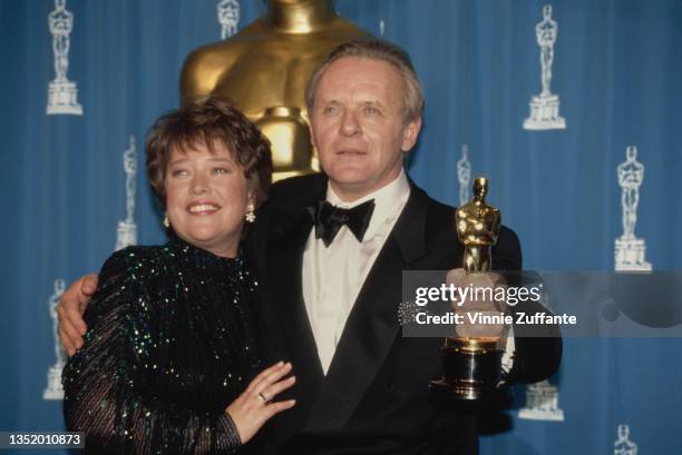 American actress Kathy Bates with British actor Anthony Hopkins, holding his Best Actor award, in the press room of the 64th Annual Academy Awards,...
